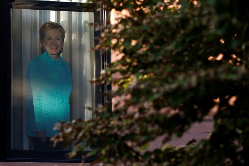 © Reuters. A photo of Democratic presidential candidate Hillary Clinton is seen on a window in the Carroll Gardens neighborhood of Brooklyn