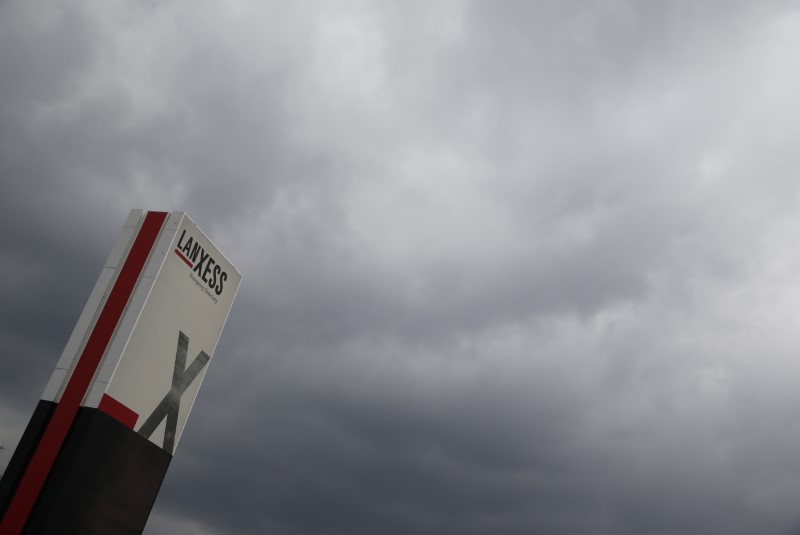 © Reuters. A logo of Lanxess is seen next to dark clouds at Cologne Bonn airport