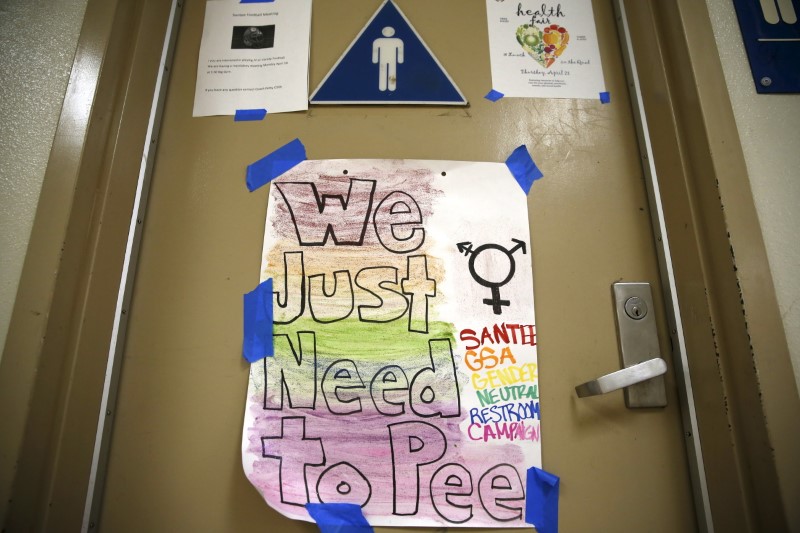 © Reuters. A protest sign on a bathroom which helped lobby for the first gender-neutral restroom in the Los Angeles school district is seen at Santee Education Complex high school in Los Angeles