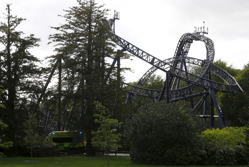 © Reuters. An ambulance drives past the Smiler ride at Alton Towers in Alton