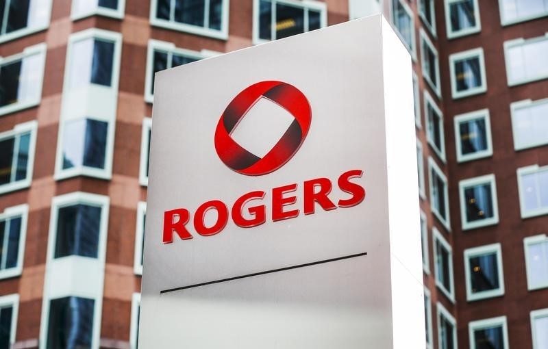 © Reuters. A sign stands in front of Rogers Communications Inc. building on the day of their annual general meeting for shareholders in Toronto