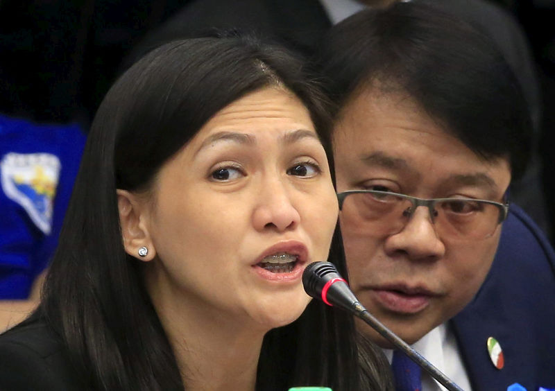 © Reuters. Maia Santos Deguito, branch manager of the RCBC answers questions during a money laundering hearing at Senate in Manila