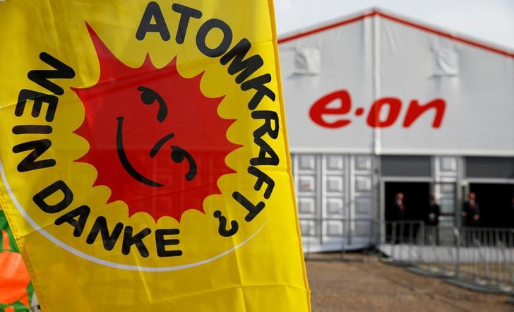© Reuters. An anti-nuclear power flag reads "Nuclear Power - No Thanks" in front of E.ON's annual general shareholders meeting in Essen