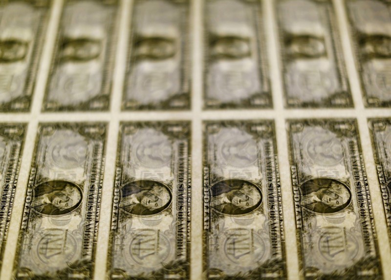 © Reuters. United States one dollar bills seen on a light table at the Bureau of Engraving and Printing in Washington