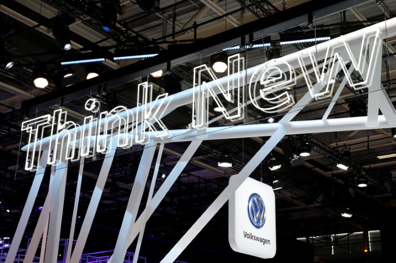 © Reuters. A lighted billboard reads "Think New" at the introduction of the new Volkswagen electric car on media day at the Paris auto show, in Paris