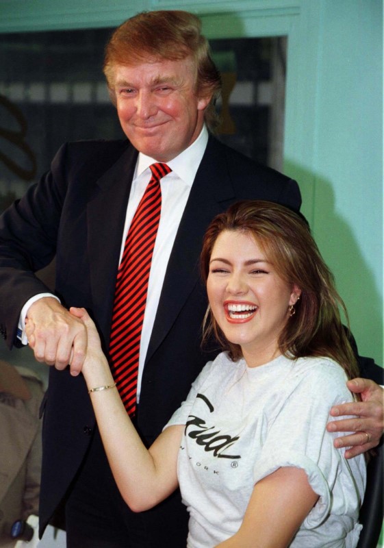 © Reuters. File photo of Miss Universe 1996, Alicia Machado of Venezuela, greeted by businessman Donald Trump during a staged workout at a gym in New York