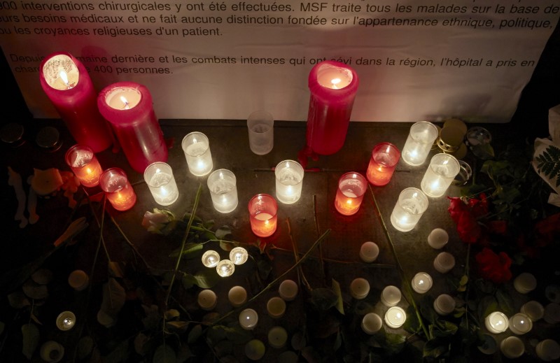 © Reuters. Candles are pictured outside the Medecins Sans Frontieres headquarters in Geneva