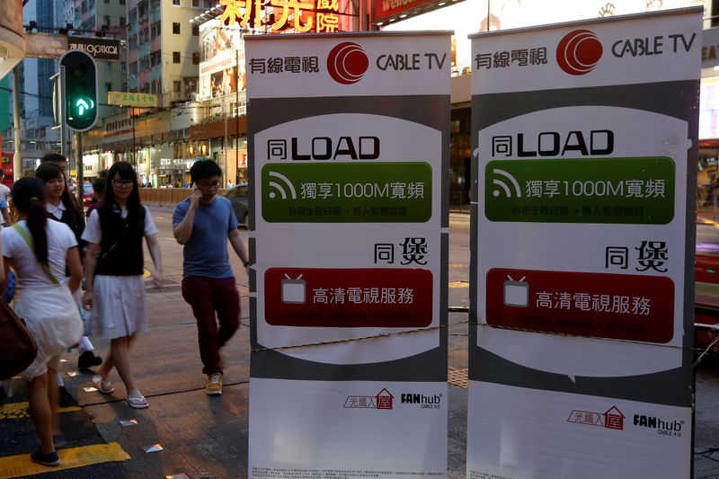 © Reuters. Banners advertising Wharf Holdings' internet business are displayed on a street in Hong Kong