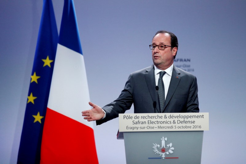 © Reuters. HOLLANDE JUSTIFIE LE SAUVETAGE D'ALSTOM-BELFORT