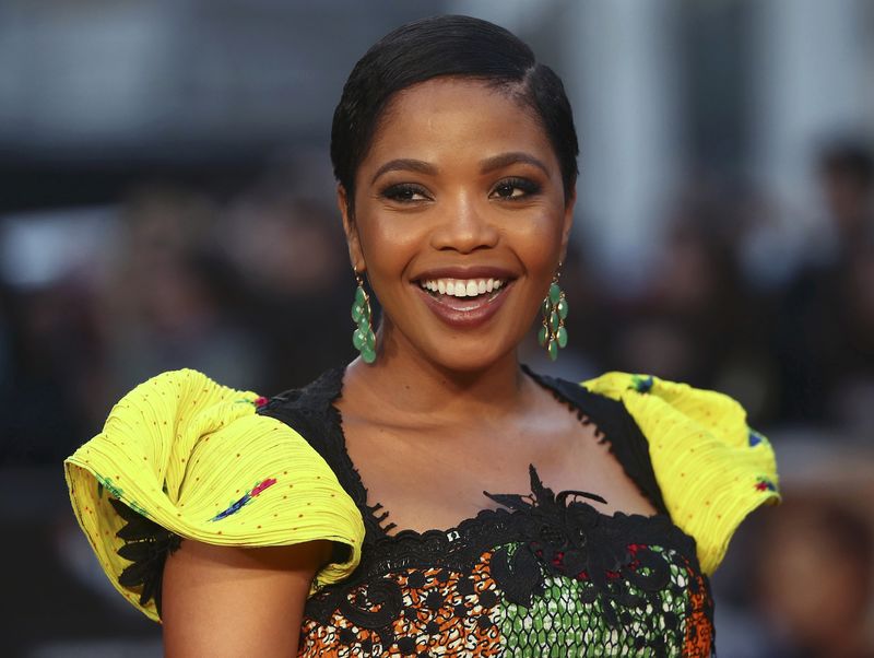 © Reuters. Actress Terry Pheto poses as she arrives for the gala screening of the film "A United Kingdom" on the opening night of the BFI London Film Festival in London