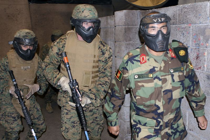 © Reuters. Brig. Gen. Muhaiuddin Ghori, commanding general, 3rd Kandak, 205th Corps, Afghan National Army, maneuvers alongside a Marine fire team on patrol at U.S. Marine Corps Base Camp Pendleton