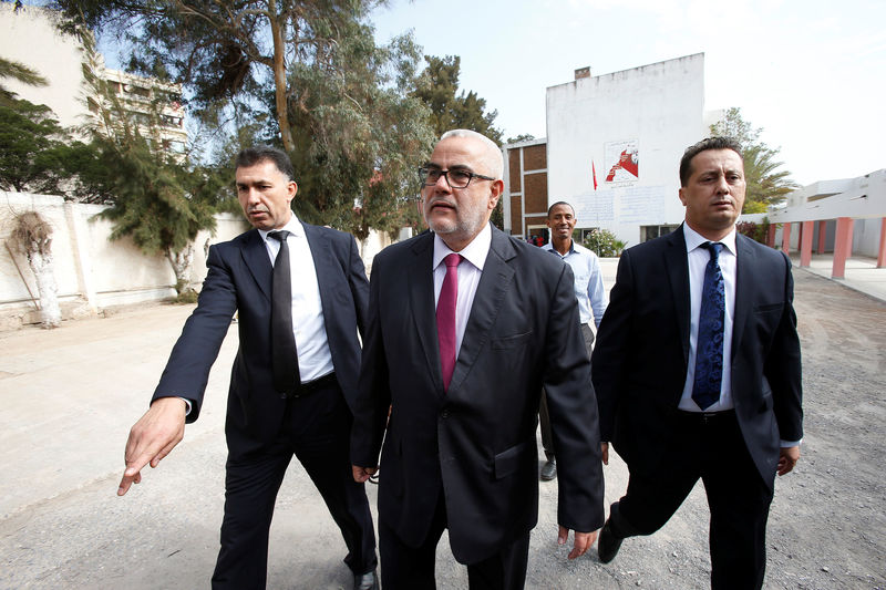 © Reuters. Abdelillah Benkirane, secretary-general of the Islamist Justice and Development party (PJD), arrives at a polling station in Rabat