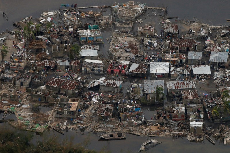 © Reuters. Destroyed houses are seen in a village after Hurricane Matthew passes Corail