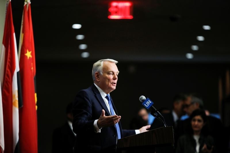 © Reuters. France's Foreign Minister Jean-Marc Ayrault speaks with media after voting on a draft resolution that demands an immediate end to air strikes and military flights over Syria's Aleppo city, at the U.N. Headquarters