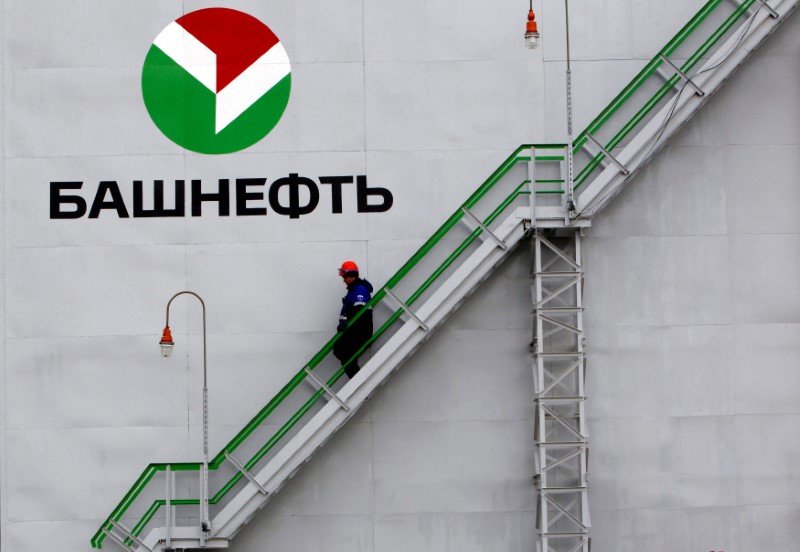 © Reuters. File photo of employee walking down stairs at Bashneft - Novoil refinery in Ufa