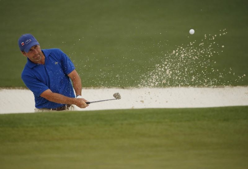 © Reuters. Jose Maria Olazabal of Spain chips from a sand trap onto the second green during second round play of the Masters golf tournament at the Augusta National Golf Course in Augusta