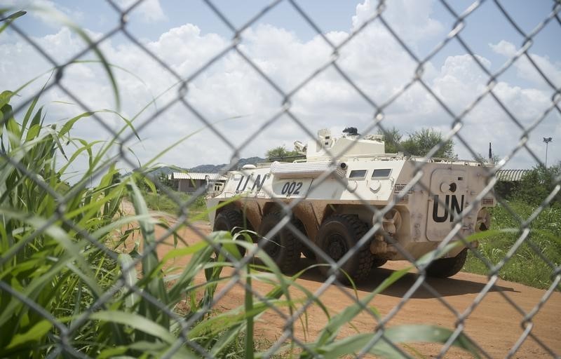 © Reuters. A United Nations peacekeepers ride in their APC as they patrol the perimeter of the protection of civilians site hosting about 30,000 people displaced during the recent fighting in Juba, South Sudan