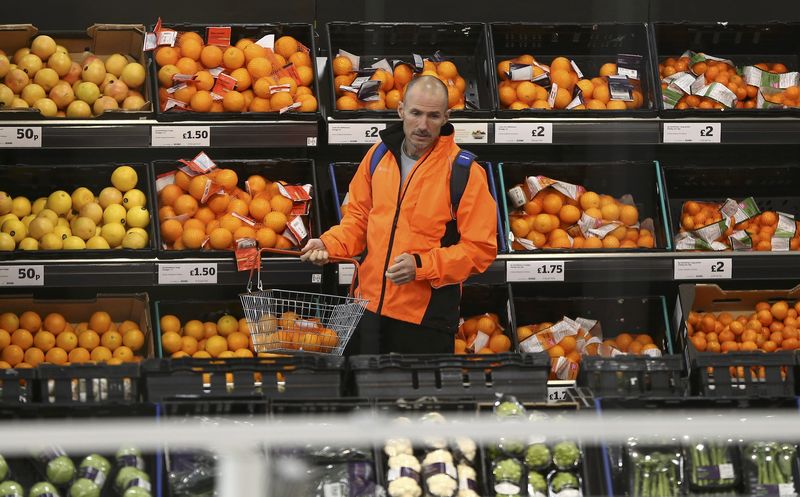 © Reuters. A man shops at a Sainsbury's store in London