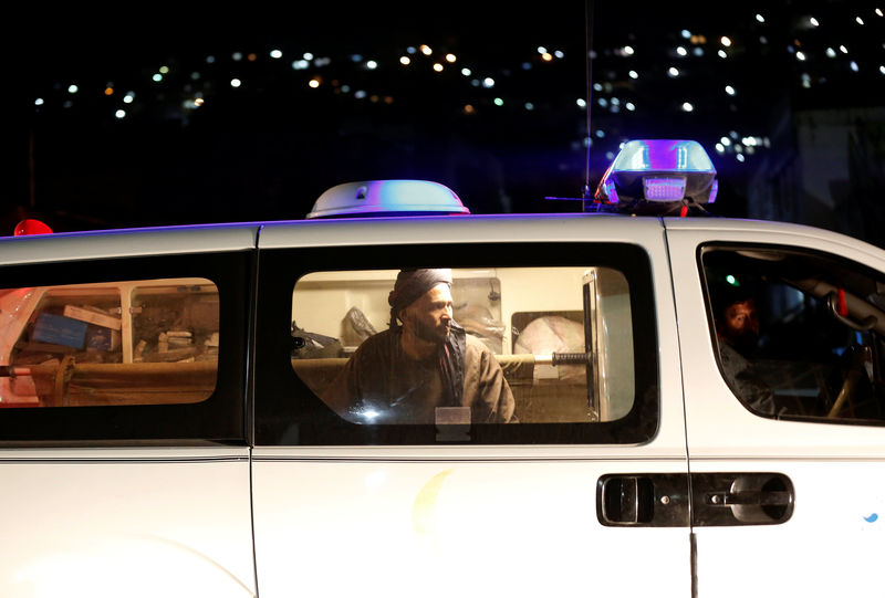 © Reuters. An Afghan man sits inside an ambulance after an attack in Kabul