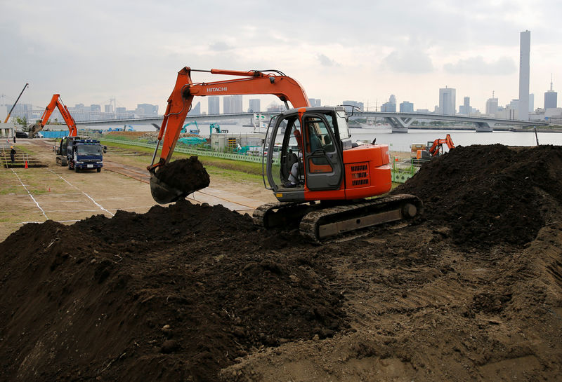 © Reuters. Excavators are seen at a construction site in Tokyo