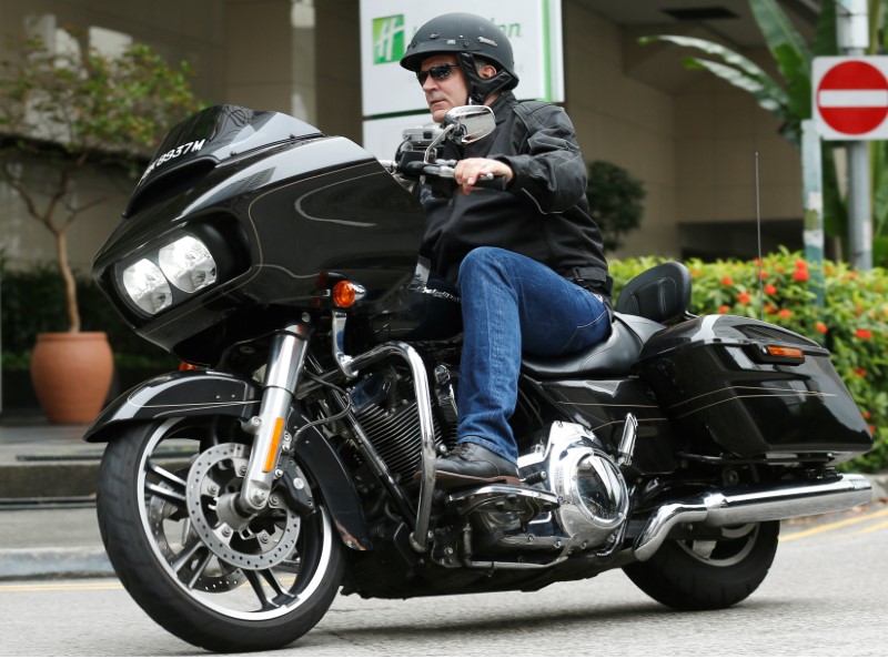 © Reuters. Harley-Davidson's CEO Levatich rides outside their head office in Singapore