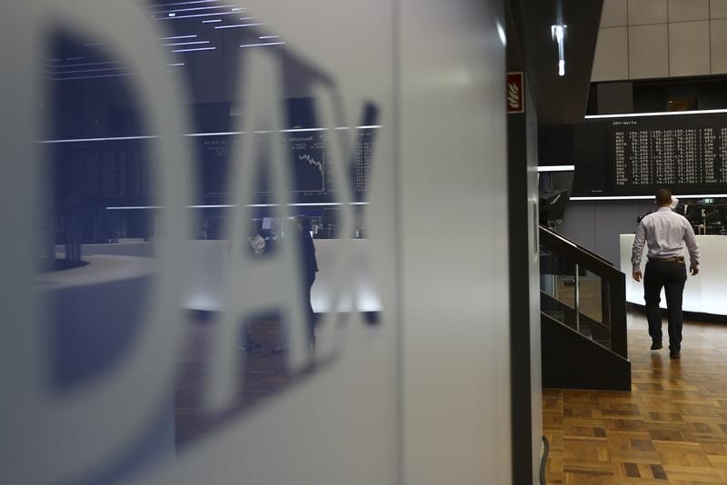 © Reuters. The German stock market index DAX is reflected in a logo at the Frankfurt stock exchange