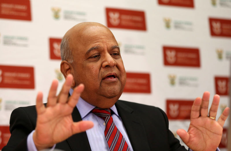 © Reuters. South African finance minister Pravin Gordhan gestures in his office in Pretoria, as he speaks via video link to a Thomson Reuters investment conference in Cape Town South Africa