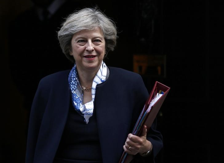 © Reuters. Britain's Prime Minister Theresa May leaves Number 10 Downing Street to attend Prime Minister's Questions at parliament in London