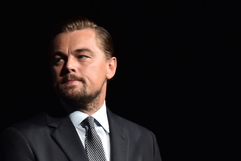 © Reuters. US actor Leonardo DiCaprio looks on prior to speaking on stage during the Paris premiere of the documentary film "Before the Flood" in Paris