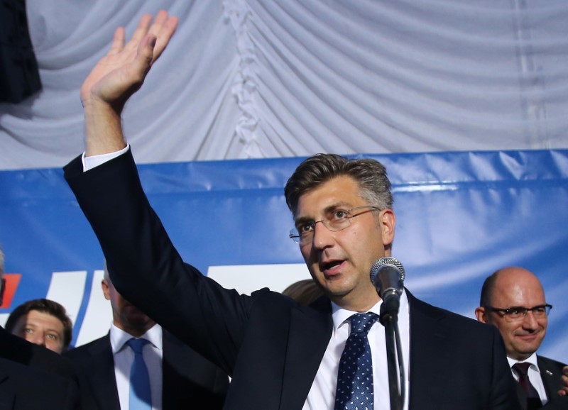 © Reuters. Andrej Plenkovic, president of the Croatian Democratic Union (HDZ), reacts during a speech after exit polls in Zagreb