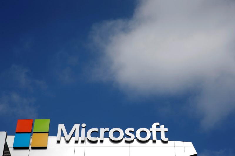 © Reuters. A Microsoft logo is seen next to a cloud the day after Microsoft Corp's $26.2 billion purchase of LinkedIn Corp, in Los Angeles, California