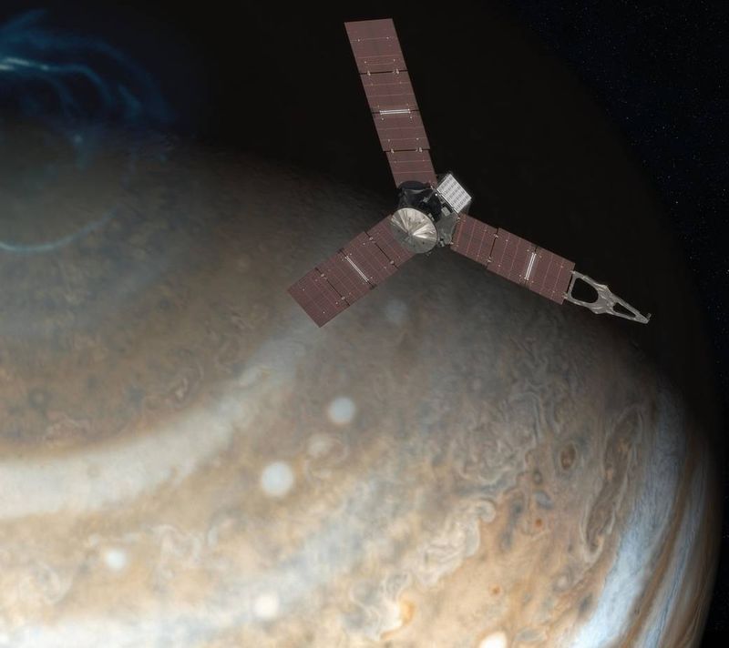 © Reuters. File photo of artist's rendering depicts NASA's Juno spacecraft above Jupiter's north pole in this undated handout image