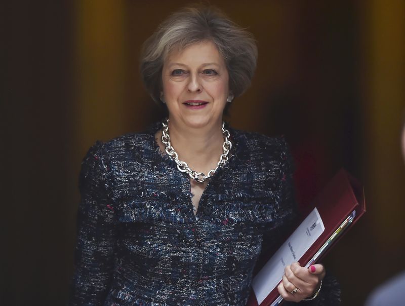 © Reuters. Prime Minister Theresa May leaves Number 10 Downing Street to attend Prime Minister's Questions at parliament in London