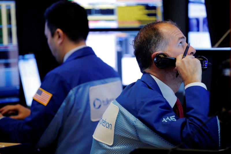 Wall Street dips as telecoms slump; AmEx surges