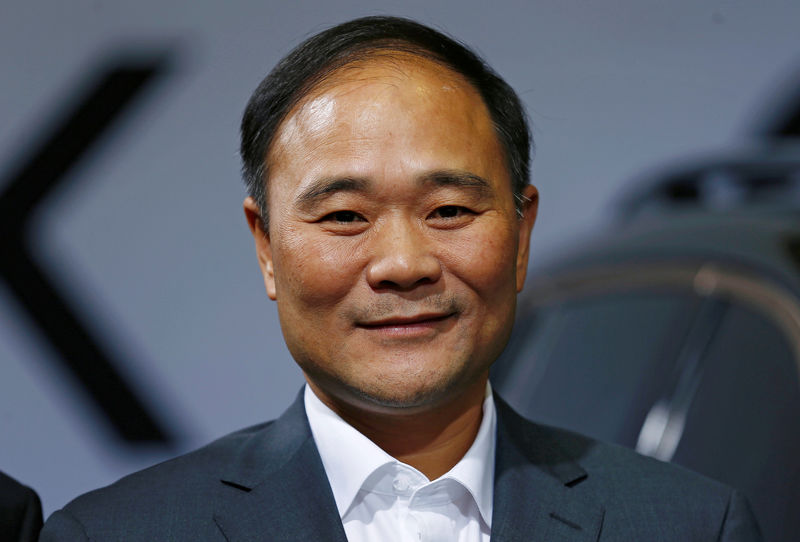 © Reuters. Geely's founder and chairman, Li Shufu, poses for a picture during the unveiling of the Chinese automaker Geely's first model Lynk & Co in Berlin