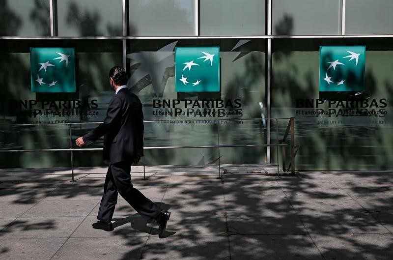 © Reuters. A man walks past a BNP Paribas bank office in Madrid