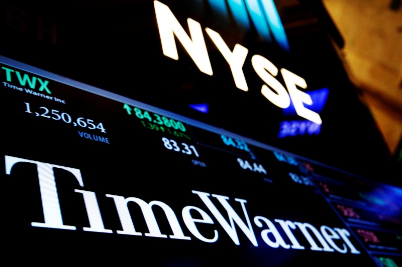 © Reuters. Ticker and trading information for media conglomerate Time Warner Inc. is displayed at the post where it is traded on the floor of the New York Stock Exchange in New York City