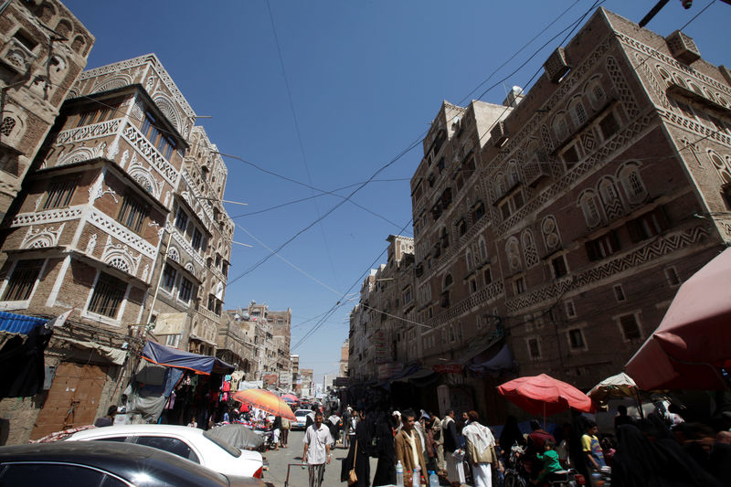 © Reuters. People shop at the old market in the historic city of Sanaa
