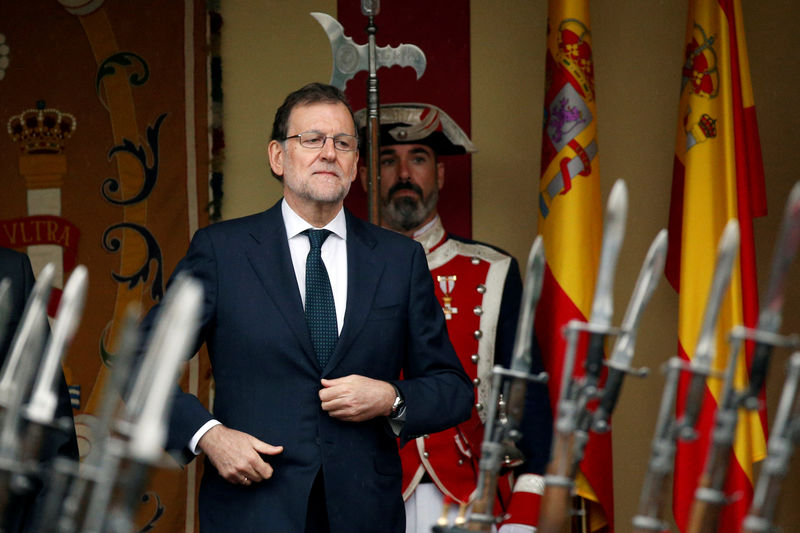© Reuters. Spain's acting Prime Minister and People's Party leader Rajoy attends a military parade marking Spain's National Day in Madrid