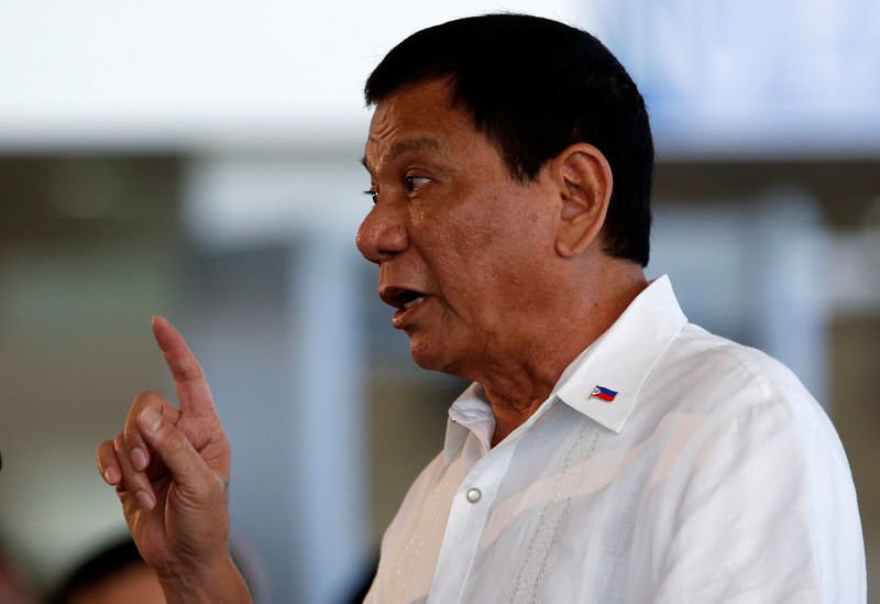 © Reuters. President Rodrigo Duterte speaks before his departure for Japan, at the Ninoy Aquino International airport in Paranaque, Metro Manila