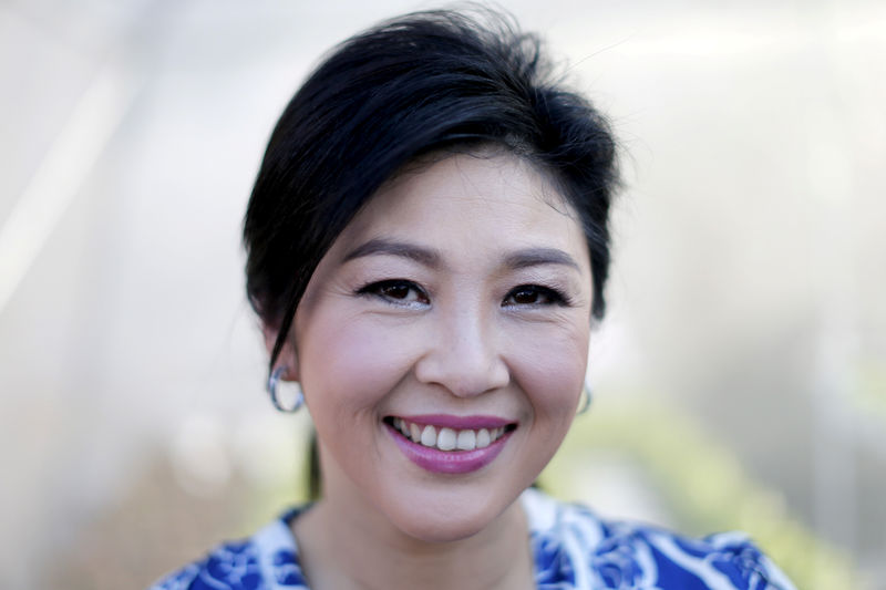 © Reuters. Ousted former Thai PM Yingluck Shinawatra poses for a portrait while receiving foreign media at her vegetables garden at her house in Bangkok