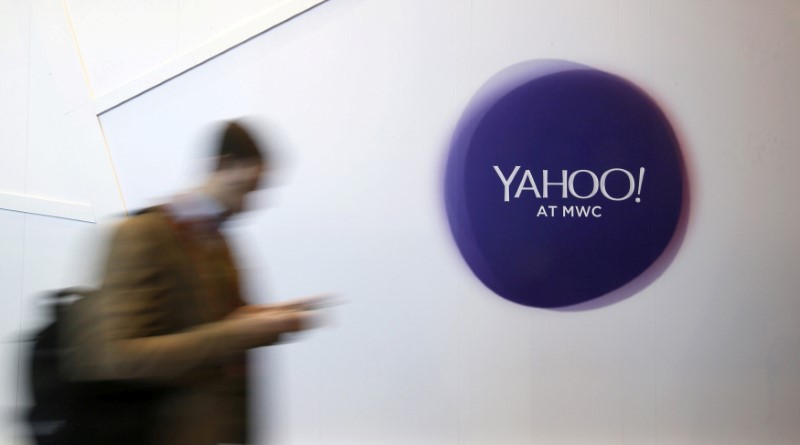 © Reuters. File photo of a man walking past a Yahoo logo during the Mobile World Congress in Barcelona