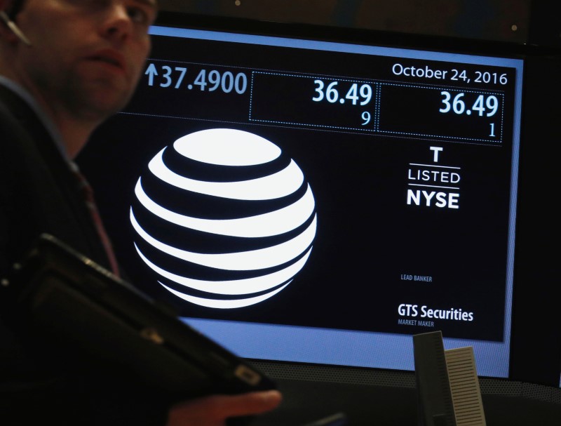 © Reuters. Ticker and trading information for telecoms company AT&T are displayed at the post where it is traded on the floor of the NYSE