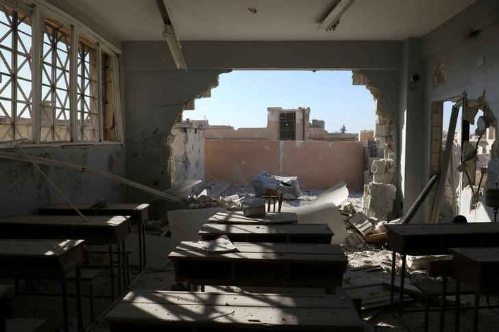 © Reuters. A damaged classroom is pictured after shelling in the rebel held town of Hass, south of Idlib province