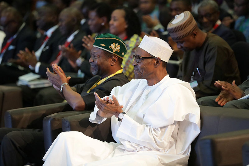 © Reuters. Nigeria's President Muhammadu Buhari and Minister of Budget and National Planning Udo Udoma Udo attend NESG 2016 in Abuja