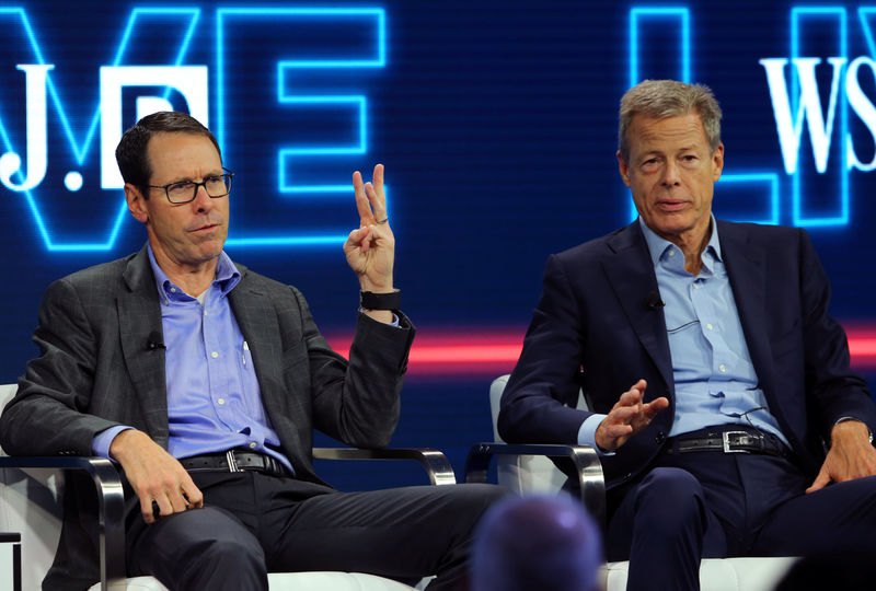 © Reuters. AT&T CEO Randall Stephenson and Time Warner Inc CEO Jeff Bewkes discuss their companies' proposed merger at the WSJD Live conference in Laguna Beach