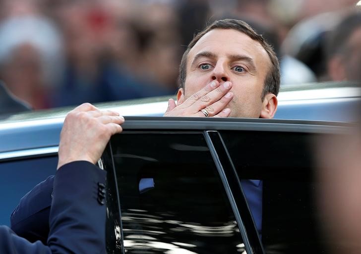 © Reuters. French President Emmanuel Macron reacts as he leaves the Hotel de Ville in Paris
