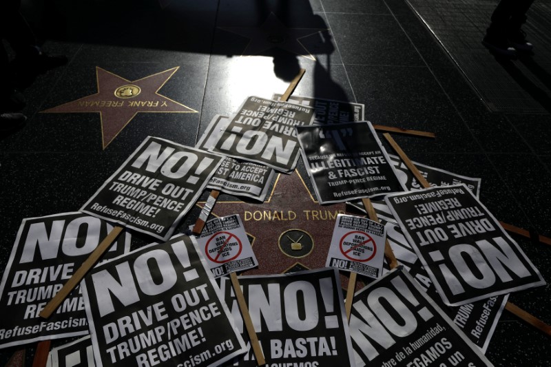 © Reuters. FILE PHOTO: People protest against President Trump's firing of FBI Director James Comey on the Hollywood Walk of Fame in Los Angeles