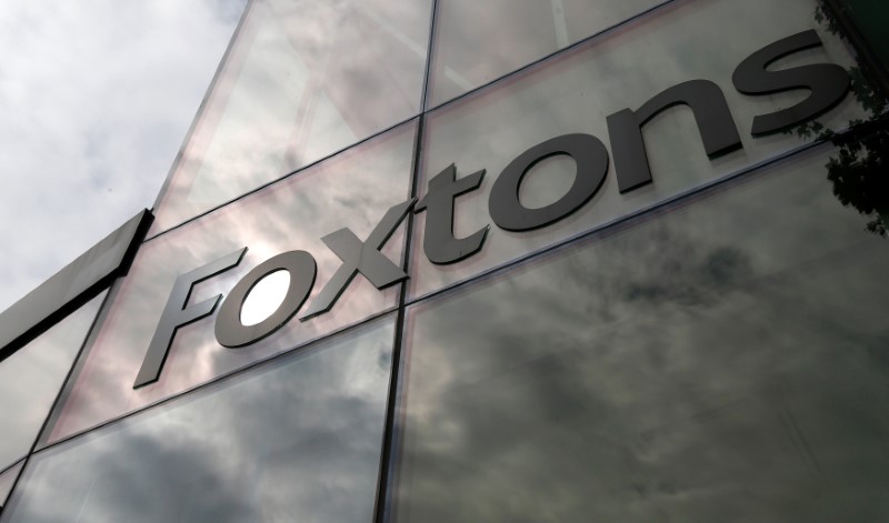 © Reuters. FILE PHOTO: A Foxtons estate agent sign on the window of a branch in north London