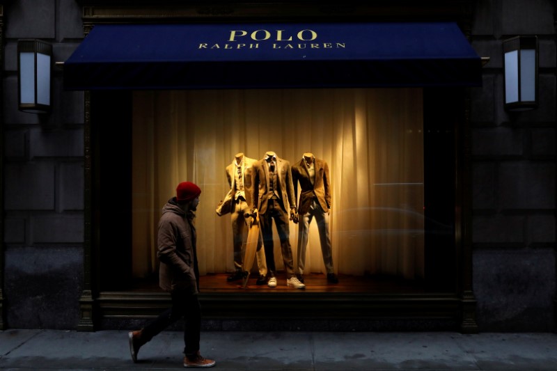 © Reuters. FILE PHOTO: A man walks past Ralph Lauren Corp.'s  flagship Polo store on Fifth Avenue in New York